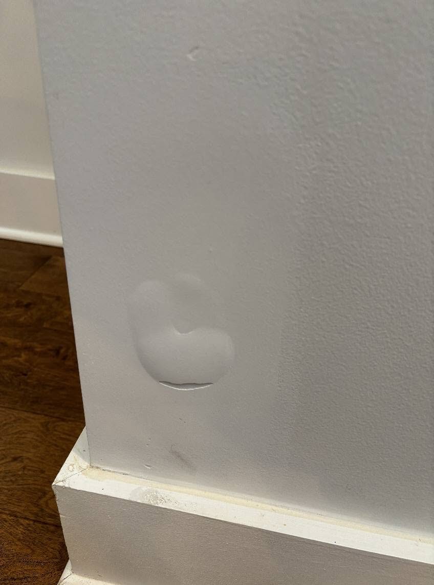 Wall damage before drywall repair